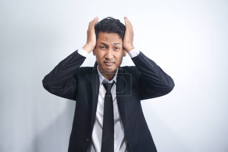 Photo for Young handsome man over isolated background suffering from headache desperate and stressed because pain and migraine. Hands on head. - Royalty Free Image