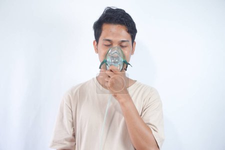 Photo for Unhealthy young man wearing oxygen mask - Royalty Free Image