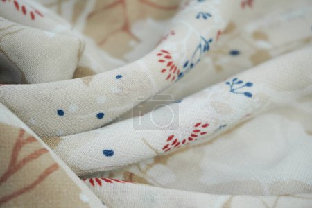 Photo for Wavy and folded fabric patterned with leaves - Royalty Free Image