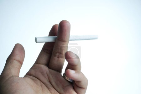 Photo for Hand holding cigarette. isolated on white background. illustration - Royalty Free Image