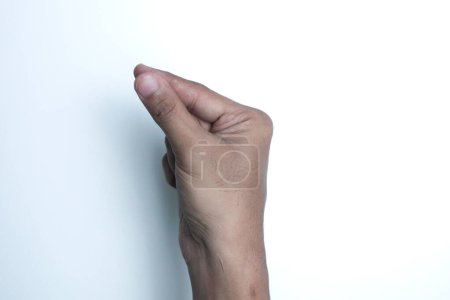 Photo for Man holding something in hand on white background, closeup - Royalty Free Image