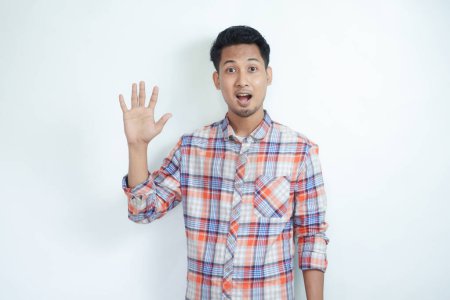 Photo for Asian man smiling happy while giving five finger up symbol - Royalty Free Image