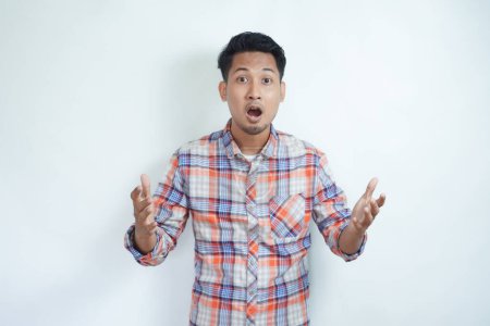 Adult Asian man looking camera with shocked expression