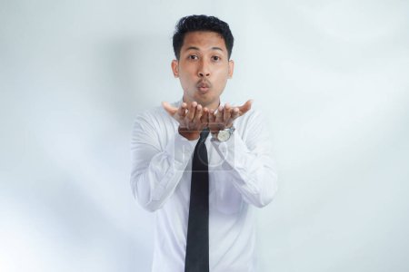 Photo for Adult Asian man smiling happy with both hand doing giving something pose - Royalty Free Image