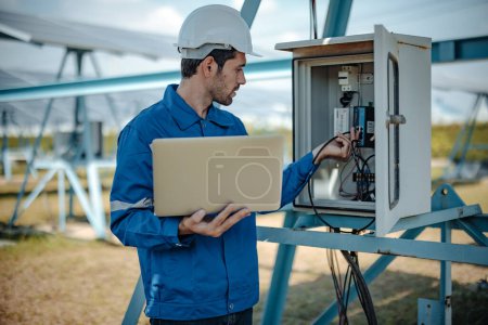 Photo for Solar electric installer and practitioner inspect electrical systems for appropriate wiring, polarity, grounding, and termination reliability. Following and adhering to safety protocols and procedures - Royalty Free Image