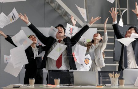 Photo for When an agile business team's performance receives positive client feedback and meets expectations, each member is excited and celebrates enthusiastically. The business team's milestone celebration. - Royalty Free Image