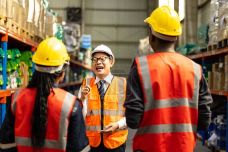 Photo for Warehouse manager assesses individual performance of staff. Evaluate work quality, skill levels, improvement needs. Giving guidance and direction. Identifying competency gaps, creating an action plan - Royalty Free Image