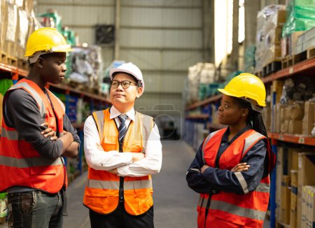 Photo for Warehouse manager assesses individual performance of staff. Evaluate work quality, skill levels, improvement needs. Giving guidance and direction. Identifying competency gaps, creating an action plan - Royalty Free Image