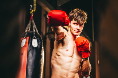 Photo for Boxers at the professional level routinely train by punching and kicking sandbags. To be successful in the individual's career, self-discipline, determination, and patience are essential qualities. - Royalty Free Image