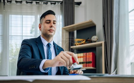 Photo for The determined business supervisor carefully analyzes the proposal contract before permitting. Once approved, the project is implemented with serious consideration, ensuring successful outcomes. - Royalty Free Image