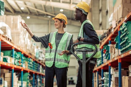 Photo for A warehouse supervisor ensures smooth inventory distribution, leads the team, and coaches new staff to meet safety goals through effective mentoring.Fostering teamwork, and professional growth. - Royalty Free Image
