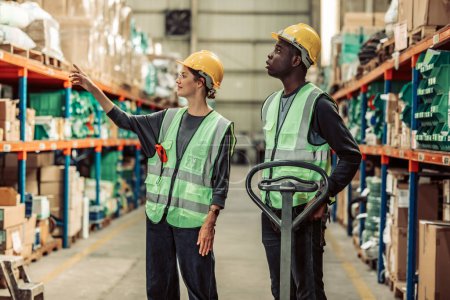 Photo for A warehouse supervisor ensures smooth inventory distribution, leads the team, and coaches new staff to meet safety goals through effective mentoring.Fostering teamwork, and professional growth. - Royalty Free Image
