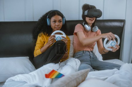 Photo for LGBT Couples play games together with a lot of joy, enthusiasm, concentration, taking turns to win and lose. A funny and exciting time. learning how to solve problems, think critically, be creative. - Royalty Free Image