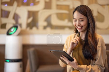 Photo for Asian female executive do a comprehensive analysis while situated in a coffee shop, granting remote approval for a prospective investment project. Carefully devised strategic decision for expansion. - Royalty Free Image