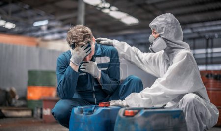 Photo for Industrial waste inspector wearing personal protective equipment to check hazardous chemicals, radioactive and toxic substances. Provide emergency first aid and immediate lifesaving care to workers. - Royalty Free Image