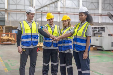 Photo for A diverse and multicultural team of cardboard workers creates positive, collaborative environment, driving and cooperating success on the manufacturing production line through engagement and teamwork - Royalty Free Image
