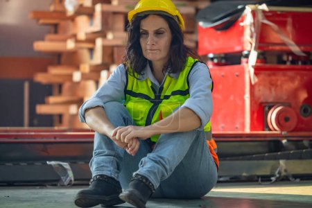 Photo for Factory workers feel burnout, exhaustion, leading to low self-esteem after an extended period of intense workload and pressure. This situation highlights the need for a more balanced, healthy approach - Royalty Free Image