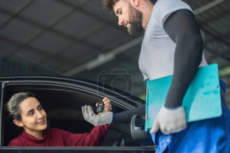 Photo for Car service technician inspect, evaluate, inform consumers about complex mechanical problems. Creating action plans, work schedules. Offering customized solutions and quotes depending on requirements - Royalty Free Image