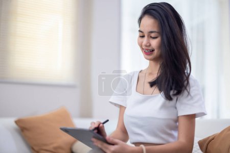Photo for College student engaged in online study at home to work on project assignment, distant learning. Collaborative brainstorming, thinking, participation in virtual classroom with lecturer and classmates - Royalty Free Image