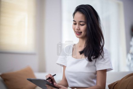 Photo for College student engaged in online study at home to work on project assignment, distant learning. Collaborative brainstorming, thinking, participation in virtual classroom with lecturer and classmates - Royalty Free Image