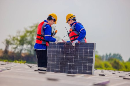 Photo for Floating solar farming technicians inspect electrical systems to ensure proper wiring, polarity, grounding, and termination reliability.  Ensuring compliance with safety regulations and procedures. - Royalty Free Image