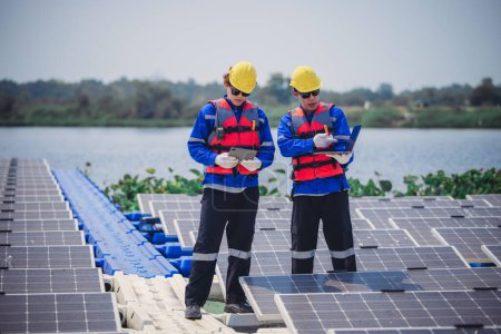Photo for Software engineers collaborate, discuss ways to enhance a smart energy analytics app for floating solar operation. Real-time monitoring optimizes data usage, analyzes efficient consumption insights. - Royalty Free Image
