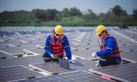 Photo for Software engineers collaborate, discuss ways to enhance a smart energy analytics app for floating solar operation. Real-time monitoring optimizes data usage, analyzes efficient consumption insights. - Royalty Free Image