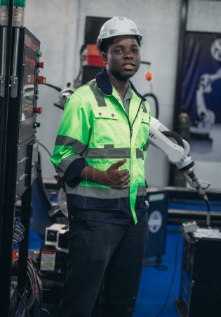 Photo for A Robotic Academy mechatronic student performs machine maintenance. addressing issues, and making technical adjustments. Gaining expertise through hands-on training, and practical experience. - Royalty Free Image