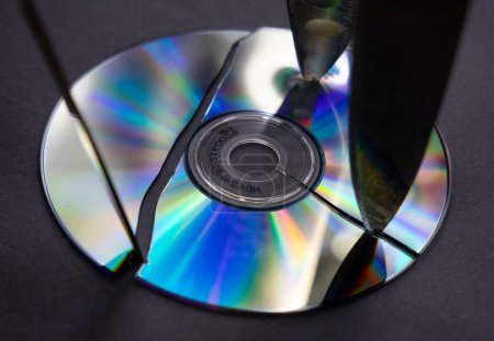 Photo for CD-ROM broken by three knives - Royalty Free Image