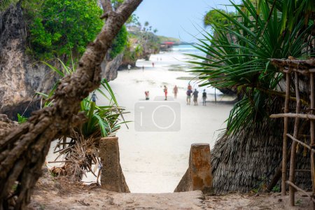 Foto de Landscape of the Indian Ocean coastline with at Mtende Beach, Zanzibar. Rocks and white sand. View from the sea - Imagen libre de derechos