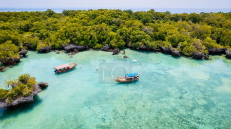 Photo for A classic Arabian dhow made of wood and commonly seen near Zanzibar in the Indian Ocean, a traditional boat from Tanzania. - Royalty Free Image