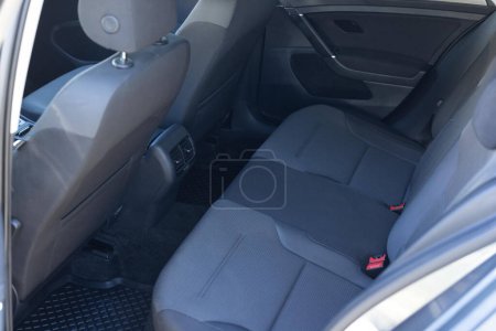 Photo for Rear seats covered with fabric in a electric car. Clean textile car back seat. Interior of the car, rear view - Royalty Free Image