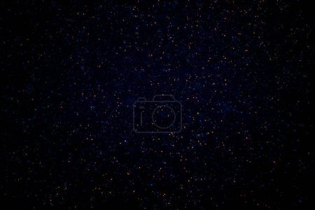 Photo for Red and blue sparks on a dark background. - Royalty Free Image
