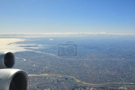 Tokyo Area from Airplane Window Jet Engine Wing. High quality photo