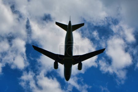jet landing on Frankfurt Airport blue sky clouds. High quality photo