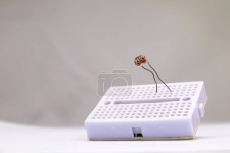 Photo for Selective focus of an LDR embedded in the project board. This part is used by electronics hobbyists for DIY materials. - Royalty Free Image