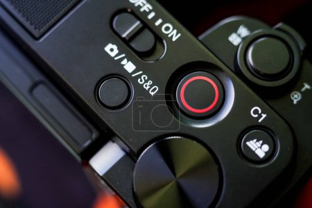 Close-up of camera shutter lever, record button, video recording mode and slow motion