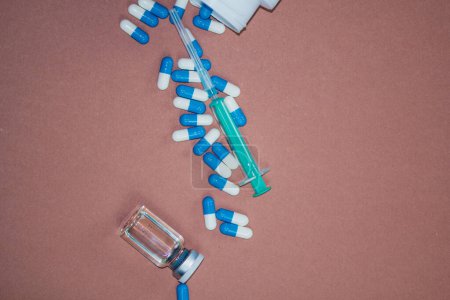 Photo for Syringe with needle, vial and pills with steroids. illegal doping in sport concept - Royalty Free Image