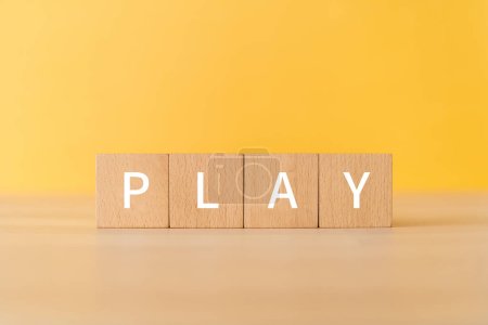 Wooden blocks with "PLAY" text of concept.