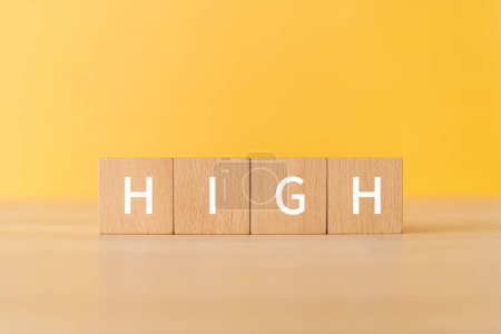 Photo for Wooden blocks with "HIGH" text of concept. - Royalty Free Image