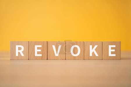 Photo for Wooden blocks with "REVOKE" text of concept. - Royalty Free Image