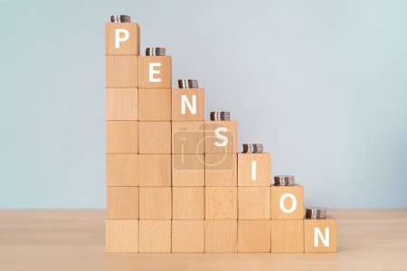 Wooden blocks with "PENSION" text of concept and coins.