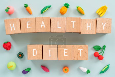 Photo for Wooden blocks with "HEALTHY DIET" text of concept and food toys. - Royalty Free Image
