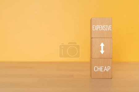 Photo for Wooden blocks with "CHEAP EXPENSIVE" text of concept. - Royalty Free Image