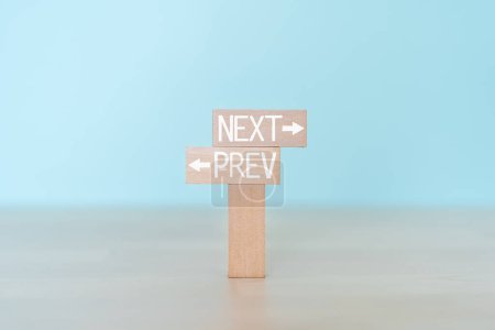 Photo for NEXT and PREV; Wooden blocks with "NEXT" and "PREV" text of concept. - Royalty Free Image