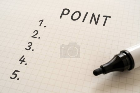 White paper written "POINT" with a marker.