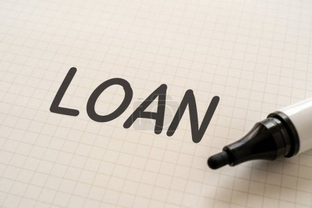 Photo for White paper written "LOAN" with markers. - Royalty Free Image