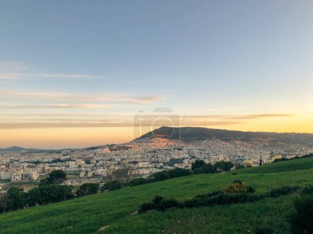 Photo for Panoramic and stunning view of the vibrant and bustling cityscape in northern Morocco, capturing the unique blend of urban life and rich cultural heritage in a magnificent display of architecture and beauty - Royalty Free Image