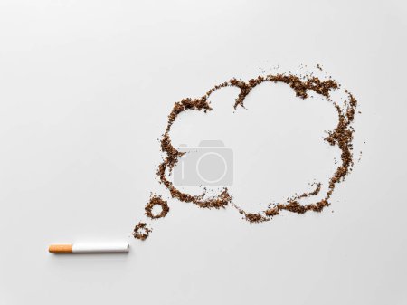 Cigarette with tobacco shaped into speech bubble on white background, representing quitting smoking and health awareness concept. No tobacco day. High quality photo
