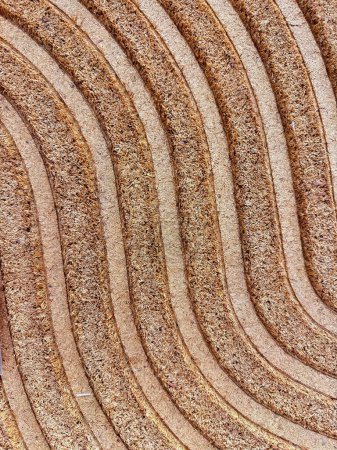 Texture close up of concentric circles on compressed coconut coir for natural fiber background. Natural background for design, websites or cards. High quality photo